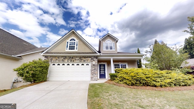 900 Ellesmere Pt, Mcdonough, GA 30253 - traditional-style home with stucco siding, stone siding, and driveway