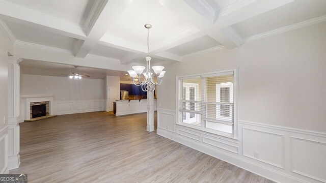 900 Ellesmere Pt, Mcdonough, GA 30253 - unfurnished dining area with coffered ceiling, a decorative wall, beam ceiling, a stone fireplace, and light wood-type flooring