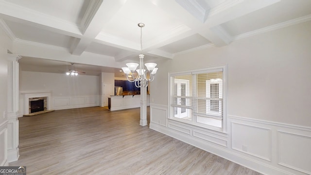 900 Ellesmere Pt, Mcdonough, GA 30253 - unfurnished dining area with coffered ceiling, a decorative wall, beamed ceiling, a fireplace, and light wood-style flooring