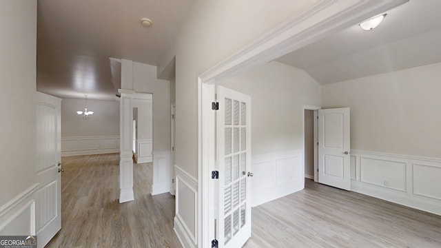 900 Ellesmere Pt, Mcdonough, GA 30253 - bonus room with wainscoting, a decorative wall, light wood-style floors, a chandelier, and vaulted ceiling