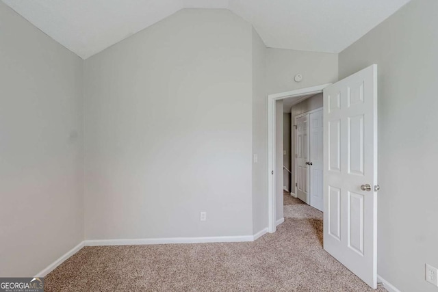 4889 Hidden Creek Pl, Decatur, GA 30035 - spare room featuring vaulted ceiling and light carpet