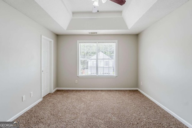 4889 Hidden Creek Pl, Decatur, GA 30035 - unfurnished room with a tray ceiling, carpet, and a ceiling fan