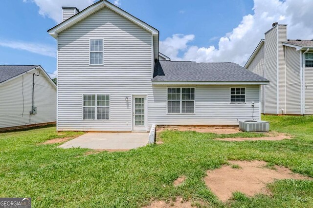 4889 Hidden Creek Pl, Decatur, GA 30035 - rear view of property with a patio area, a chimney, a yard, and roof with shingles