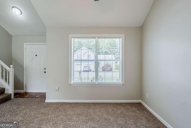 4889 Hidden Creek Pl, Decatur, GA 30035 - unfurnished living room featuring plenty of natural light, carpet flooring, and stairs
