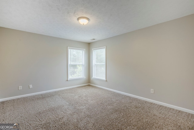 8826 Lakecrest Way, Union City, GA 30291 - spare room featuring carpet flooring and a textured ceiling