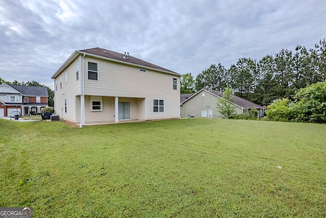 8826 Lakecrest Way, Union City, GA 30291 - rear view of property featuring a yard