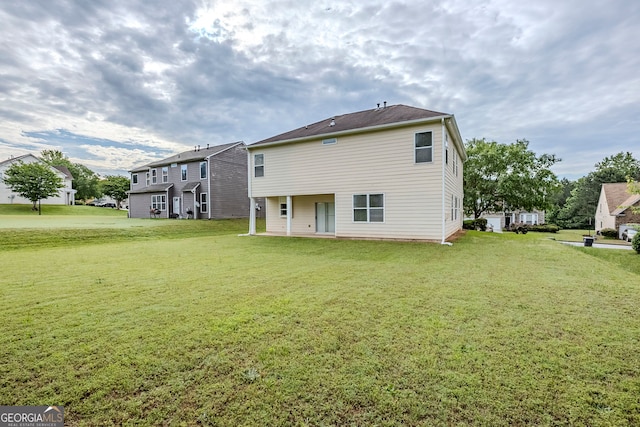 8826 Lakecrest Way, Union City, GA 30291 - rear view of property featuring a yard