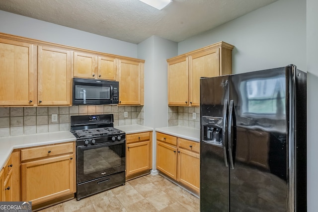 8826 Lakecrest Way, Union City, GA 30291 - kitchen with black appliances, backsplash, light countertops, a textured ceiling, and light brown cabinets