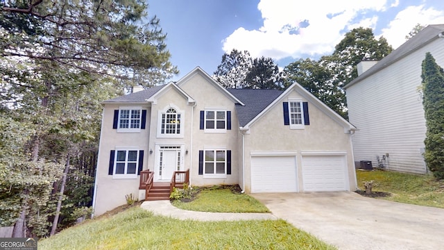 4912 Lightwood Ct NW, Acworth, GA 30102 - view of front of house featuring stucco siding, driveway, central air condition unit, and an attached garage
