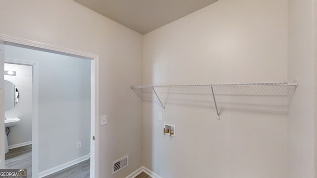 4912 Lightwood Ct NW, Acworth, GA 30102 - clothes washing area with wood finished floors, hookup for a washing machine, and baseboards