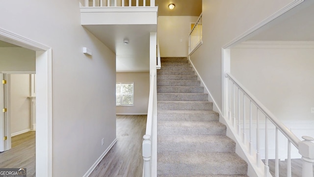 4912 Lightwood Ct NW, Acworth, GA 30102 - staircase featuring wood finished floors and baseboards