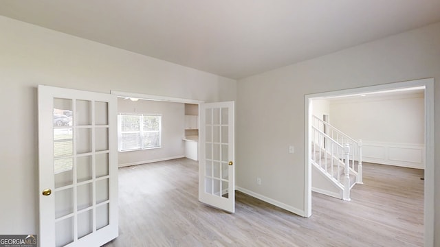 4912 Lightwood Ct NW, Acworth, GA 30102 - spare room with french doors, wood finished floors, and baseboards