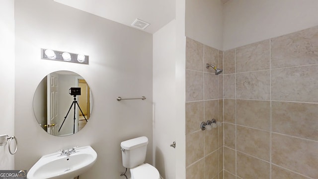 4912 Lightwood Ct NW, Acworth, GA 30102 - full bathroom featuring a sink, tiled shower, and toilet