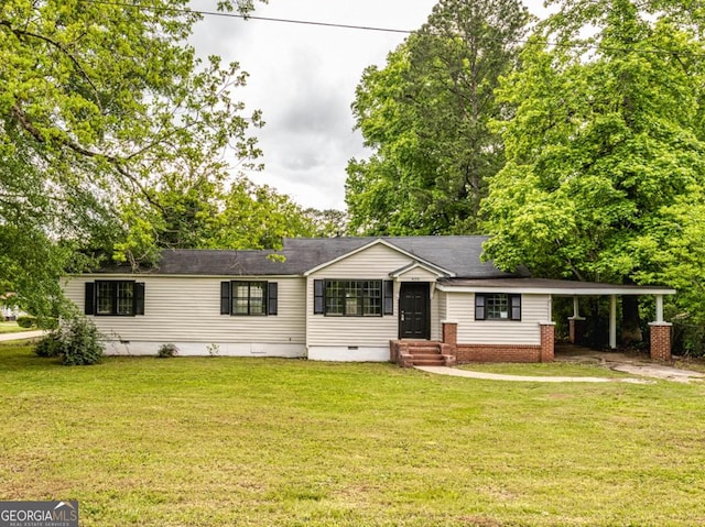 ranch-style home with crawl space, a front lawn, and a carport