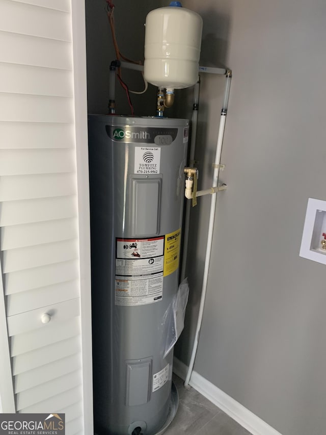 utility room with electric water heater
