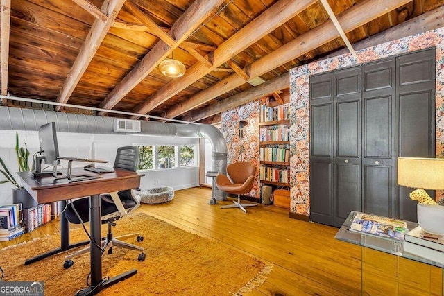 office area with wood ceiling, hardwood / wood-style floors, beam ceiling, and arched walkways