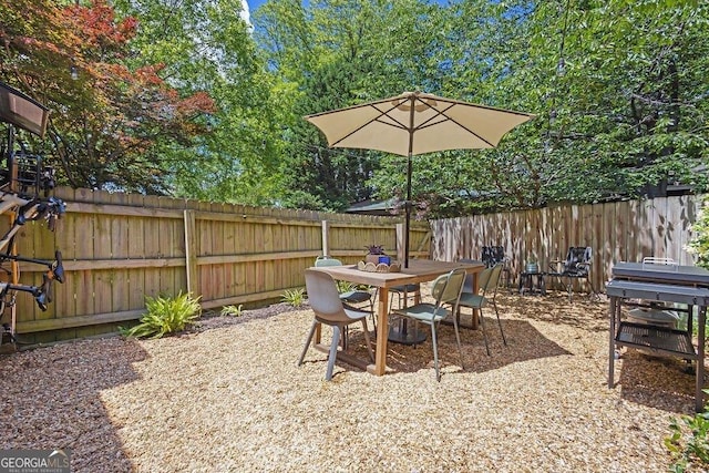 view of patio / terrace with a fenced backyard and outdoor dining space