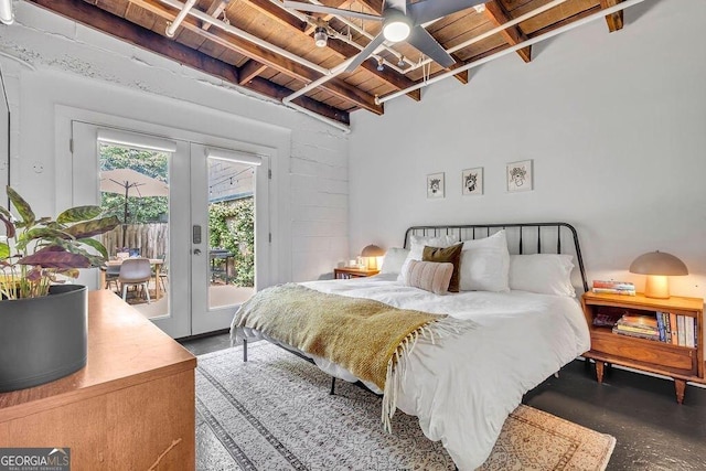 bedroom with wood ceiling, access to outside, french doors, and beamed ceiling