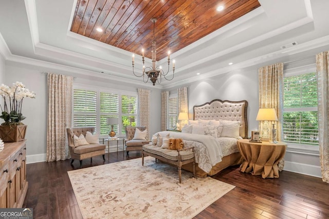 bedroom with a raised ceiling, baseboards, dark wood-style flooring, a chandelier, and ornamental molding