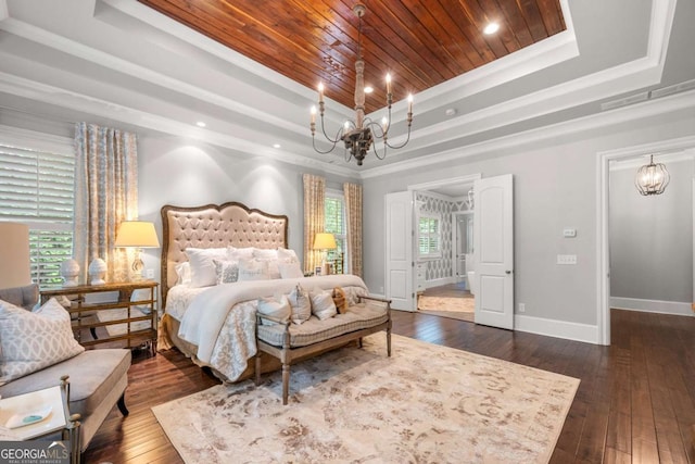 bedroom with a tray ceiling, a chandelier, wood ceiling, dark wood-style floors, and baseboards