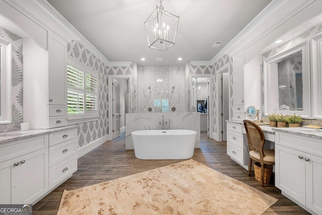 bathroom with a chandelier, a tile shower, vanity, crown molding, and recessed lighting