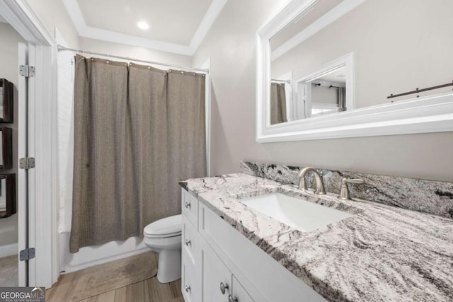bathroom featuring toilet, vanity, wood finished floors, and shower / tub combo with curtain