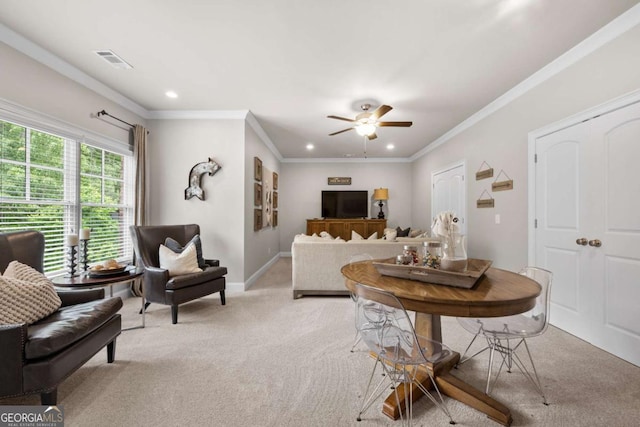 dining room with light carpet, recessed lighting, a ceiling fan, ornamental molding, and baseboards