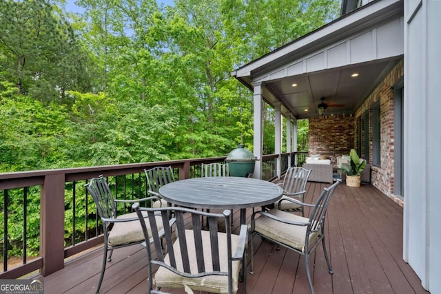deck featuring ceiling fan and outdoor dining space