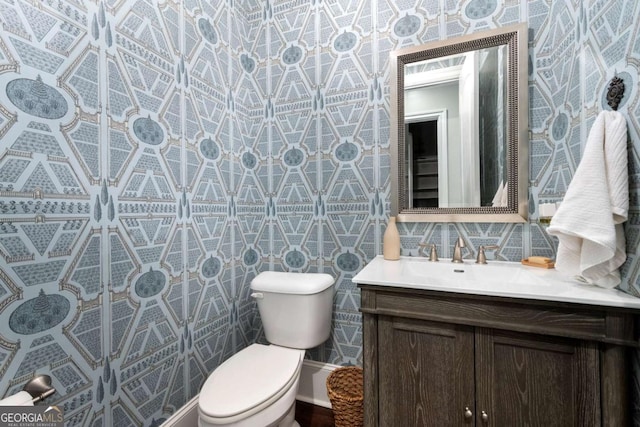 bathroom with toilet and vanity