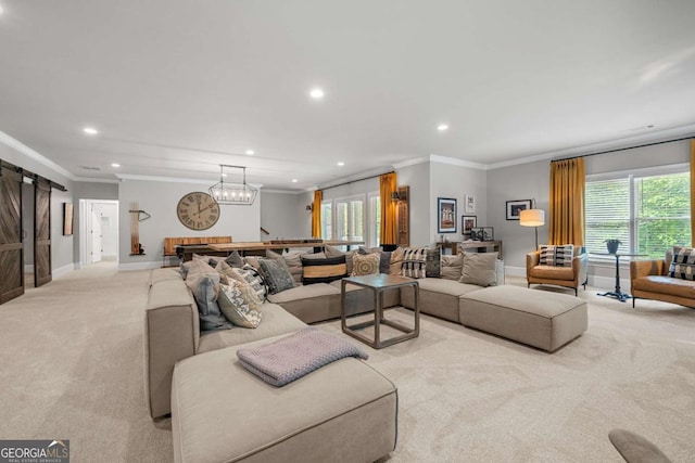 carpeted living room with recessed lighting, ornamental molding, baseboards, healthy amount of natural light, and a barn door