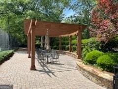 view of home's community with a patio area and outdoor dining space