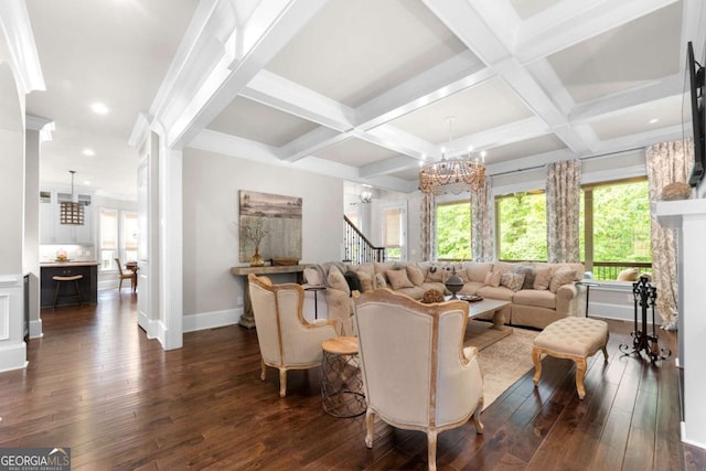 living area with a chandelier, dark wood-style flooring, baseboards, coffered ceiling, and beam ceiling