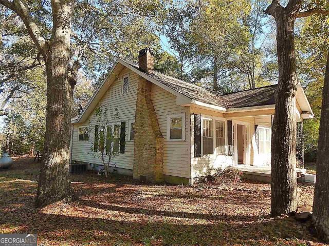 view of side of property with a chimney
