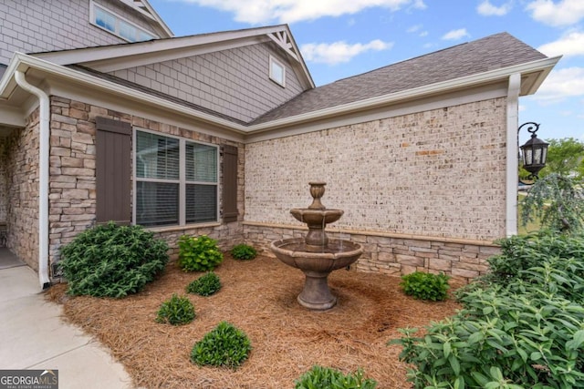 438 Southland Cir, Canton, GA 30115 - view of home's exterior with stone siding and roof with shingles