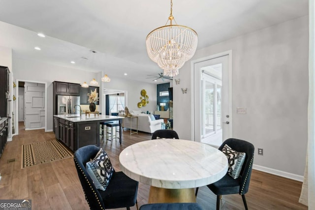 438 Southland Cir, Canton, GA 30115 - dining space featuring a chandelier, dark wood-type flooring, baseboards, and recessed lighting