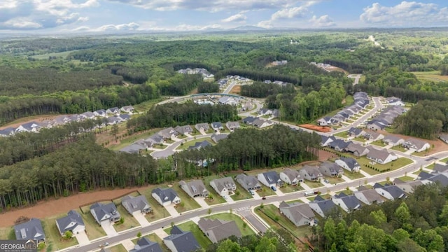 438 Southland Cir, Canton, GA 30115 - aerial view of property and surrounding area featuring a forest and nearby suburban area
