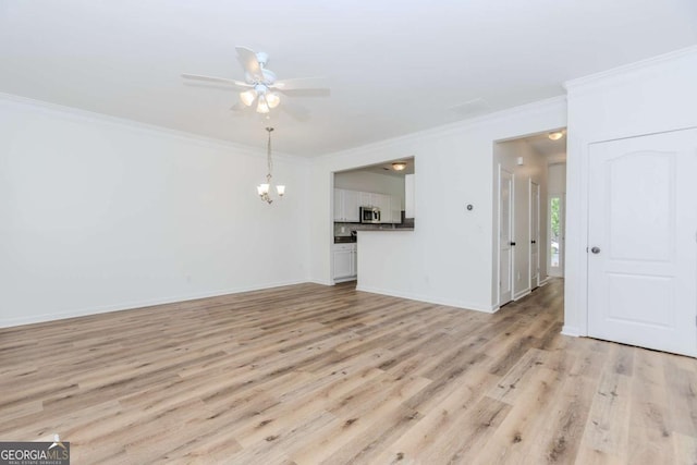 5138 Timber Hills Way, Oakwood, GA 30566 - unfurnished living room featuring crown molding, a ceiling fan, light wood-style flooring, a chandelier, and baseboards