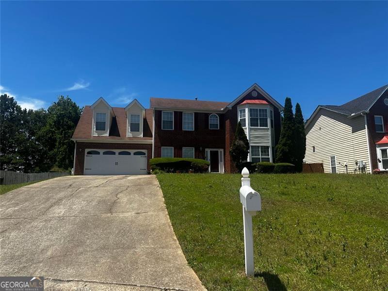 8529 Glendevon Ct, Riverdale, GA 30274 - view of front facade featuring concrete driveway