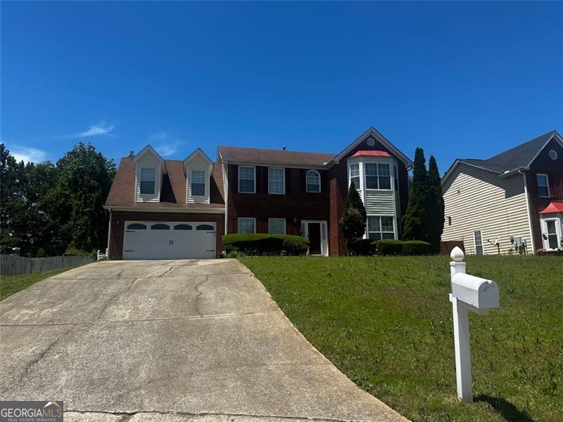 8529 Glendevon Ct, Riverdale, GA 30274 - view of front of property with concrete driveway and a front lawn