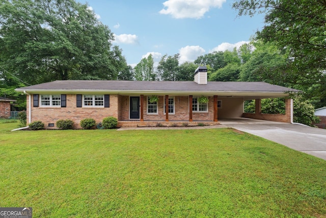 ranch-style home featuring concrete driveway, brick siding, a front yard, a carport, and a chimney