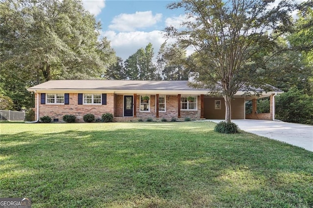 ranch-style home featuring driveway, a front yard, brick siding, and a carport
