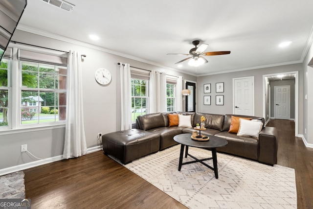living room featuring wood finished floors, ceiling fan, baseboards, crown molding, and recessed lighting