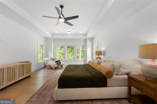 bedroom featuring wood finished floors, recessed lighting, a ceiling fan, and baseboards