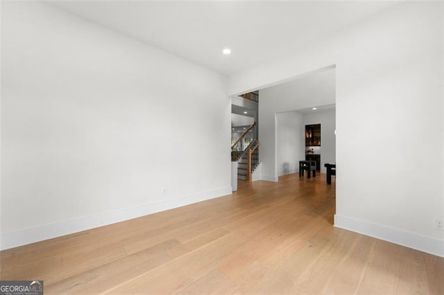 17145 River Overlook Dr, Roswell, GA 30075 - spare room with stairway, light wood-type flooring, and recessed lighting