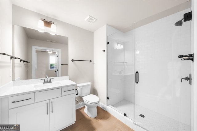 219 Phillips Ln, Alpharetta, GA 30009 - full bathroom featuring toilet, vanity, a stall shower, baseboards, and wood finished floors