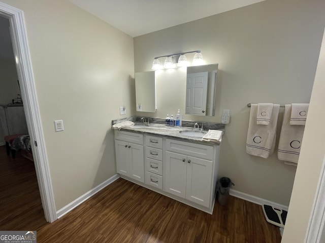659 Voyles Rd, Carnesville, GA 30521 - full bath with baseboards, wood finished floors, and double vanity