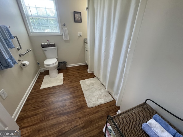 659 Voyles Rd, Carnesville, GA 30521 - full bath with wood finished floors, toilet, and baseboards