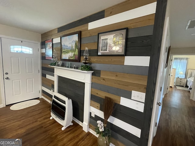 659 Voyles Rd, Carnesville, GA 30521 - entryway featuring heating unit, wood walls, and wood finished floors