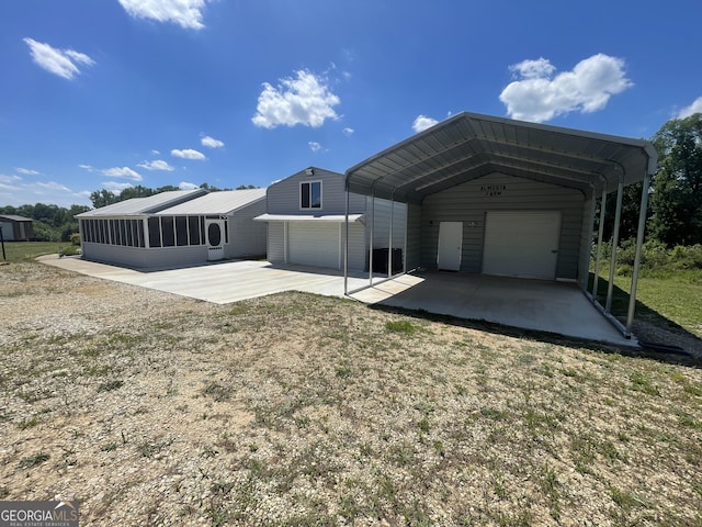 659 Voyles Rd, Carnesville, GA 30521 - rear view of house featuring a detached garage