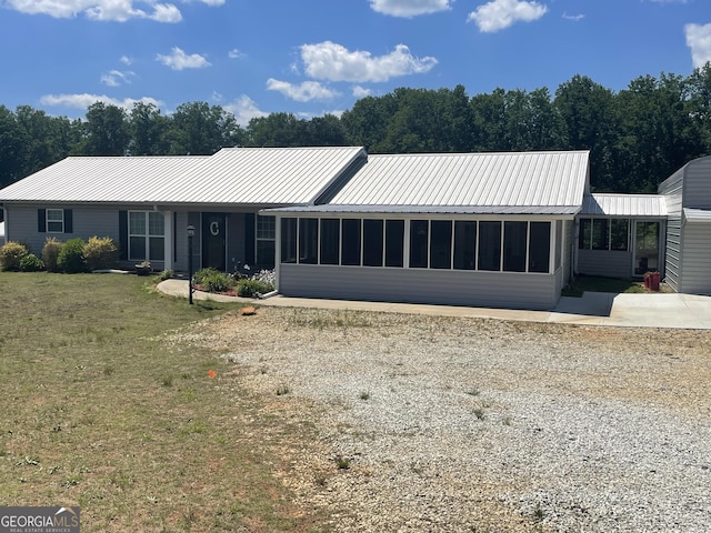 659 Voyles Rd, Carnesville, GA 30521 - view of front of property with a sunroom, metal roof, and a front yard